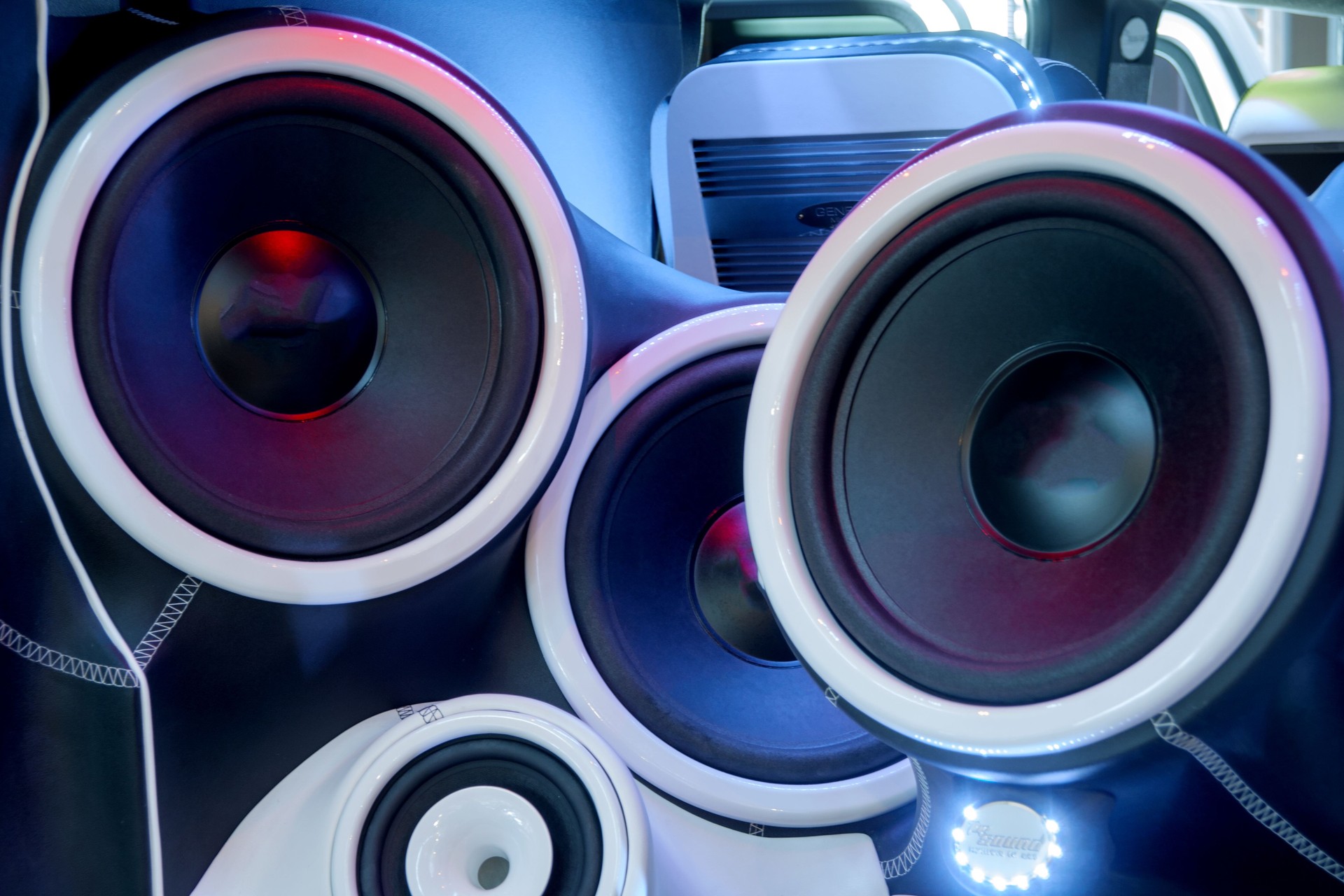 Close-up of several loudspeaker in the back of a car